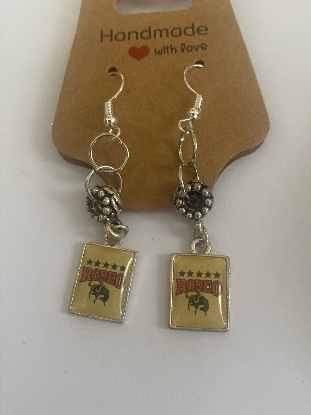 Handcrafted Rodeo Dangle Earrings in Cream and Silver